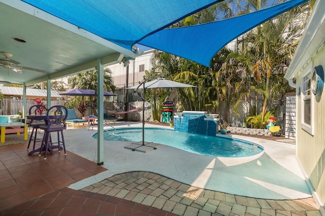 view of swimming pool with a patio and pool water feature