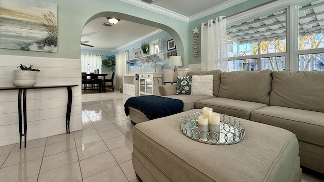 living room featuring ornamental molding and light tile patterned flooring