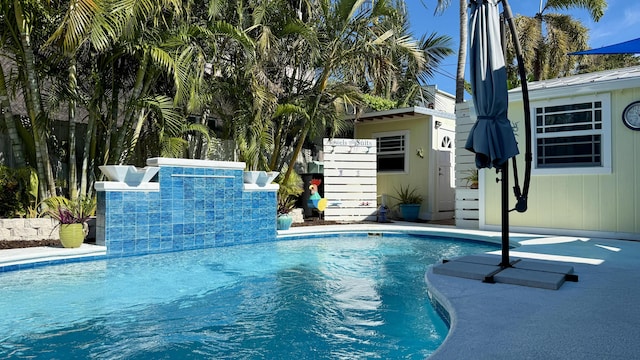 view of swimming pool featuring pool water feature