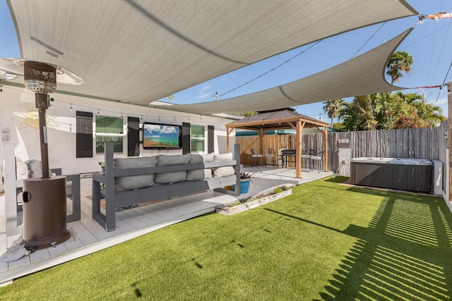 view of yard featuring a gazebo, an outdoor living space, a hot tub, and a patio area