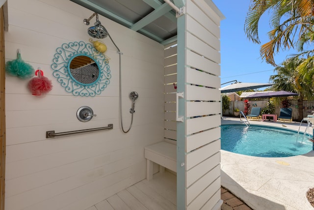 view of swimming pool featuring a patio area