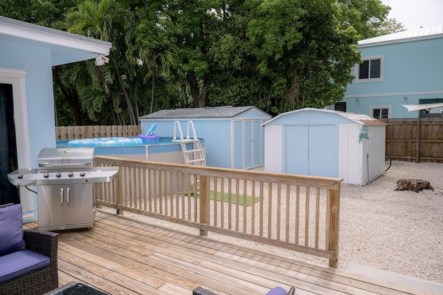 768 Musa Dr, Key Largo, FL 33037 - wooden deck with a storage shed, a fenced backyard, and area for grilling