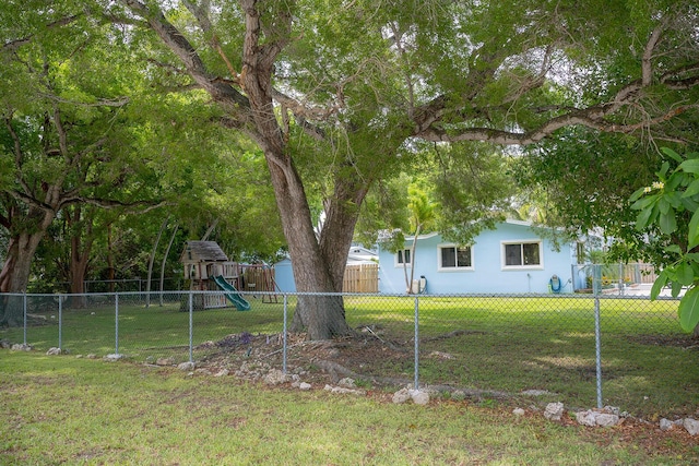 768 Musa Dr, Key Largo, FL 33037 - fenced backyard featuring a playground