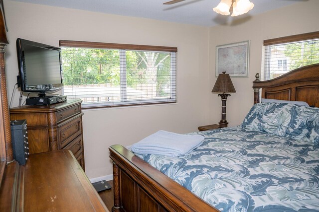 768 Musa Dr, Key Largo, FL 33037 - bedroom featuring multiple windows and ceiling fan
