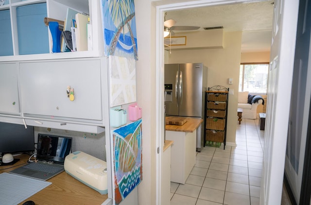768 Musa Dr, Key Largo, FL 33037 - kitchen with light tile patterned floors, stainless steel refrigerator with ice dispenser, and an office area