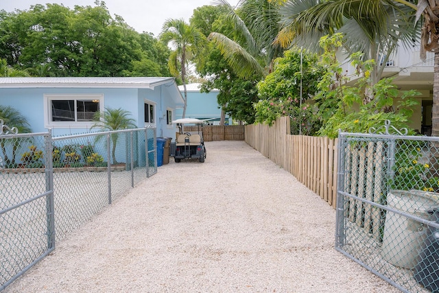 768 Musa Dr, Key Largo, FL 33037 - view of side of property with stucco siding and a metal roof