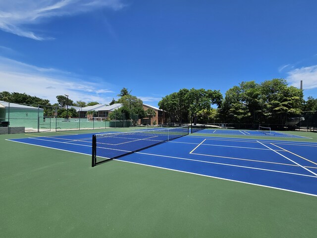 view of sport court featuring community basketball court and fence