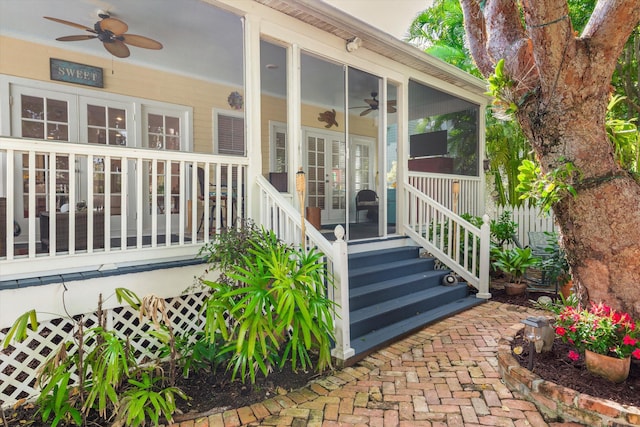 view of exterior entry with ceiling fan