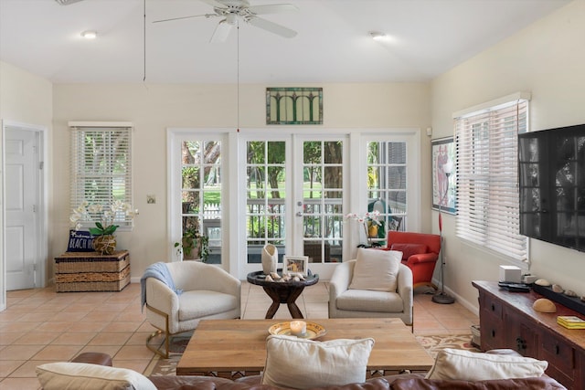 sunroom / solarium with ceiling fan and french doors