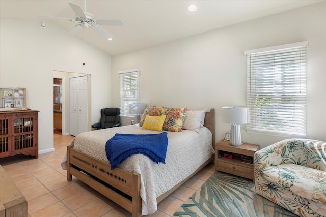 bedroom featuring lofted ceiling, a closet, recessed lighting, a ceiling fan, and light tile patterned flooring