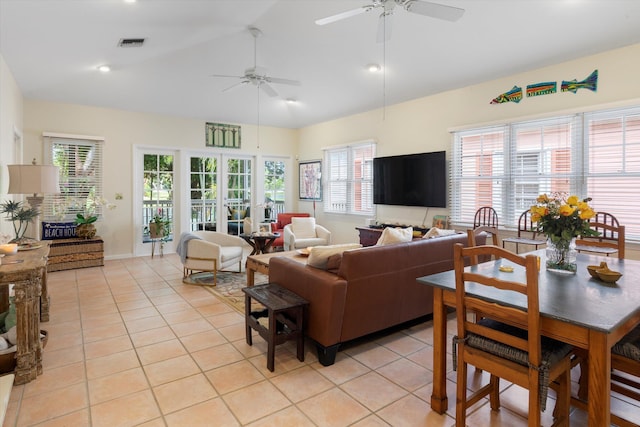 living room featuring light tile patterned floors, ceiling fan, french doors, and visible vents