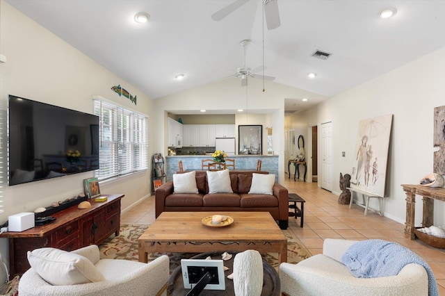 living room featuring light tile patterned floors, ceiling fan, visible vents, and vaulted ceiling