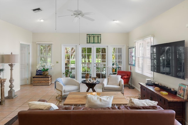 sunroom with a ceiling fan, lofted ceiling, french doors, and visible vents