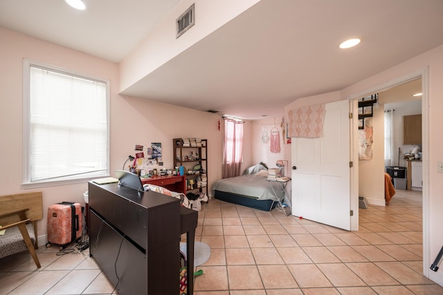 bedroom with light tile patterned floors