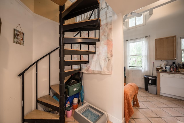 stairway featuring tile patterned floors