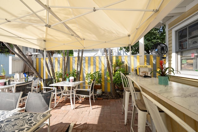 view of patio with an outdoor bar