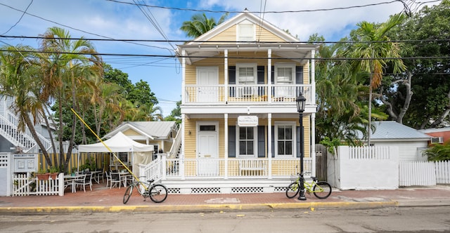 view of front of house featuring a porch and a balcony