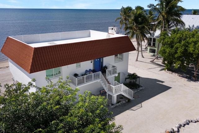 birds eye view of property with a water view