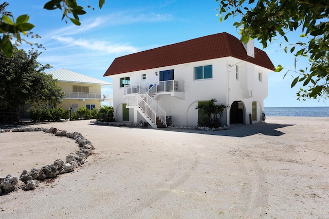 view of front of home featuring a water view