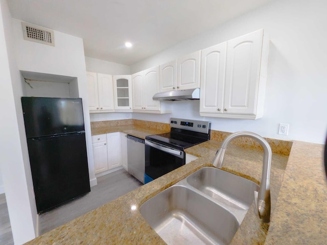 kitchen featuring sink, stainless steel appliances, and white cabinets