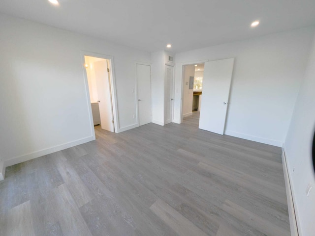 spare room featuring hardwood / wood-style flooring