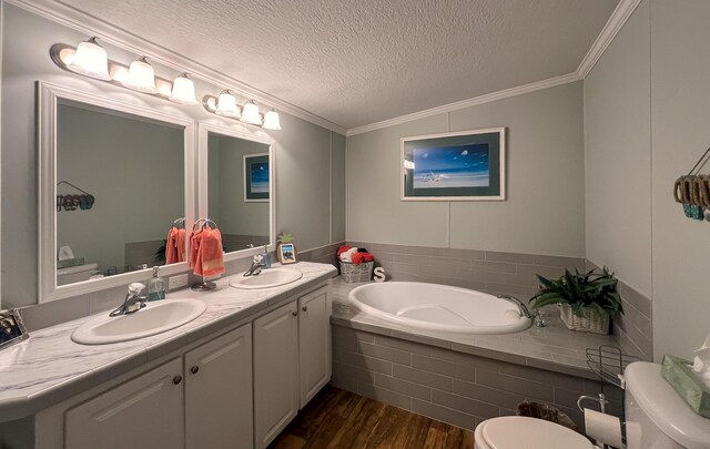 full bath with wood finished floors, a sink, and crown molding