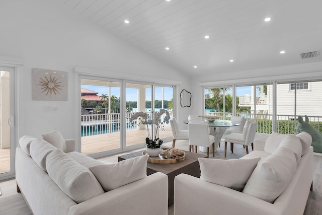 living room with wood ceiling, high vaulted ceiling, and light wood-type flooring