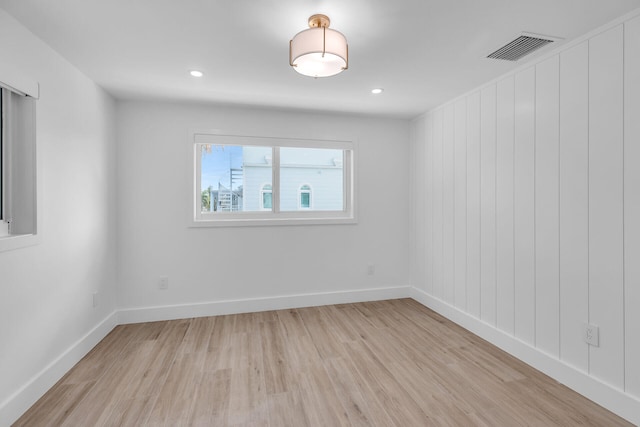 empty room with light hardwood / wood-style floors