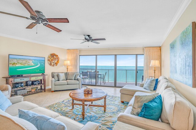 living room featuring light tile patterned floors, ceiling fan, and crown molding