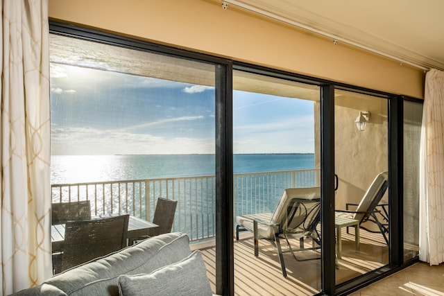 balcony featuring a water view