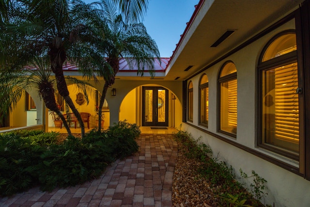 view of exterior entry at dusk