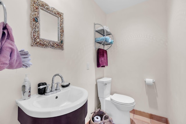 bathroom featuring sink and toilet