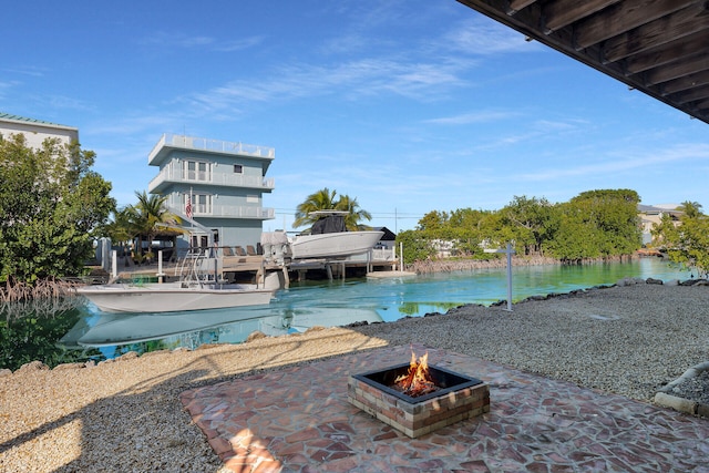 view of swimming pool with a fire pit