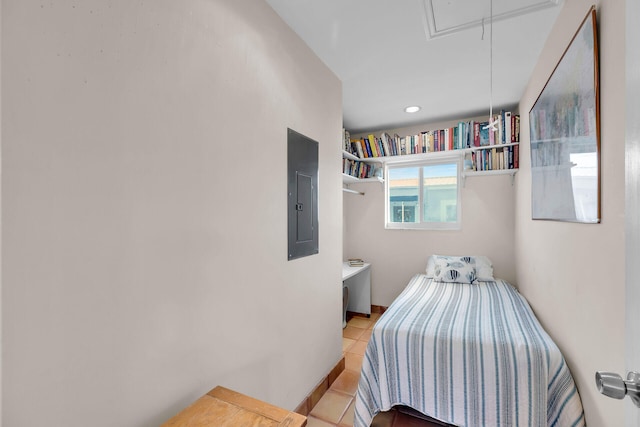 tiled bedroom with electric panel