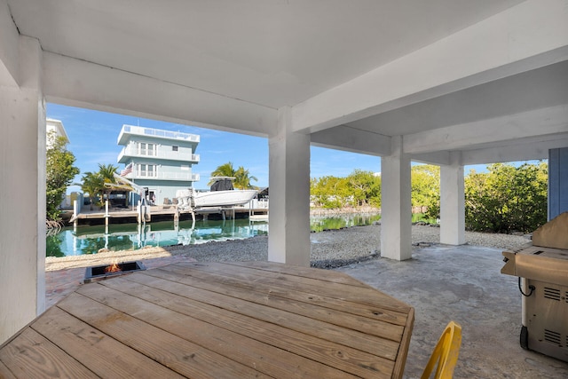 view of patio with a water view