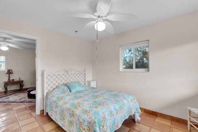 bedroom featuring ceiling fan and tile patterned floors