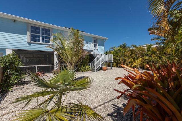 back of property with stairway