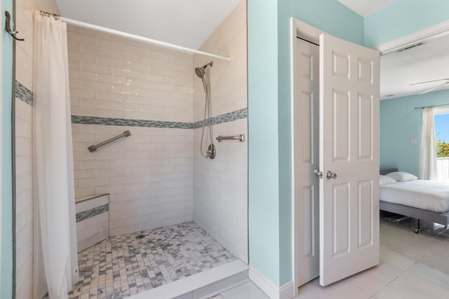 ensuite bathroom featuring visible vents, tiled shower, and ensuite bathroom