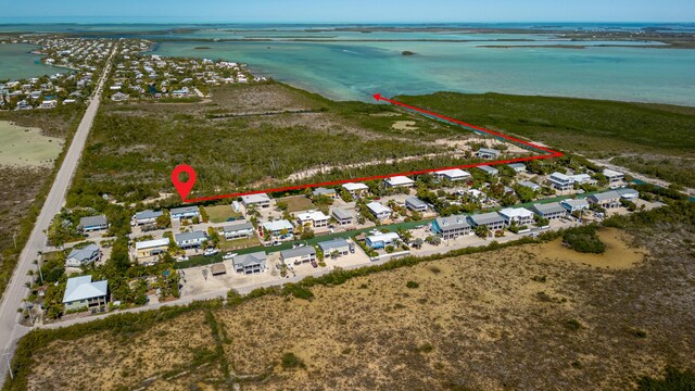 birds eye view of property with a residential view and a water view