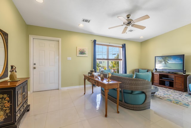 living area featuring light tile patterned floors, a ceiling fan, baseboards, visible vents, and recessed lighting