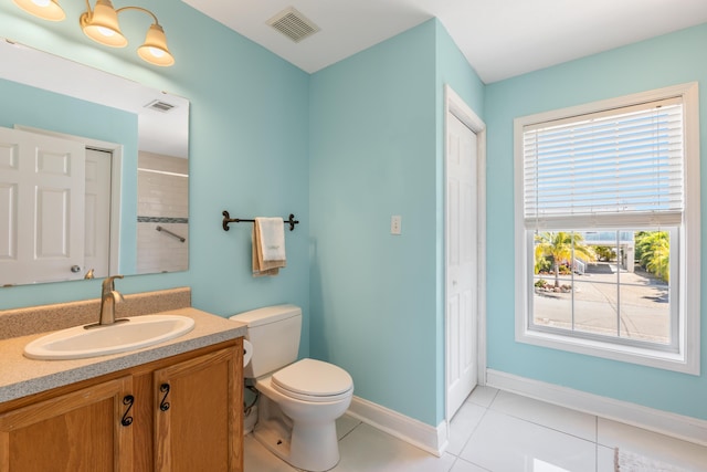 bathroom with vanity, tile patterned floors, toilet, and visible vents