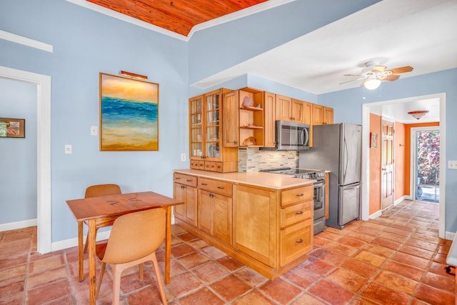 kitchen featuring tasteful backsplash, appliances with stainless steel finishes, and ceiling fan