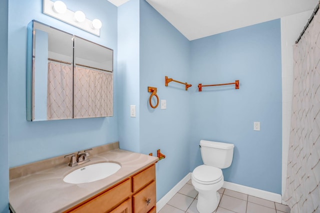 bathroom with vanity, toilet, curtained shower, and tile patterned flooring