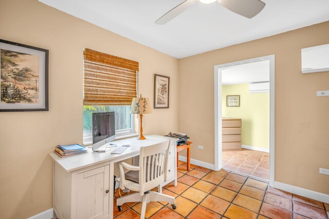 office featuring a wall mounted air conditioner, ceiling fan, and light tile patterned flooring