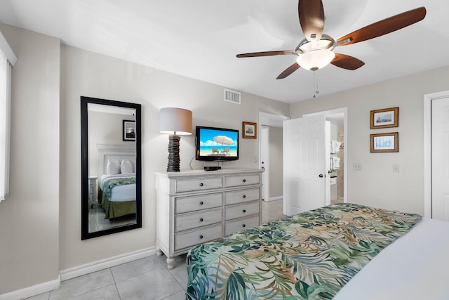 tiled bedroom with ceiling fan