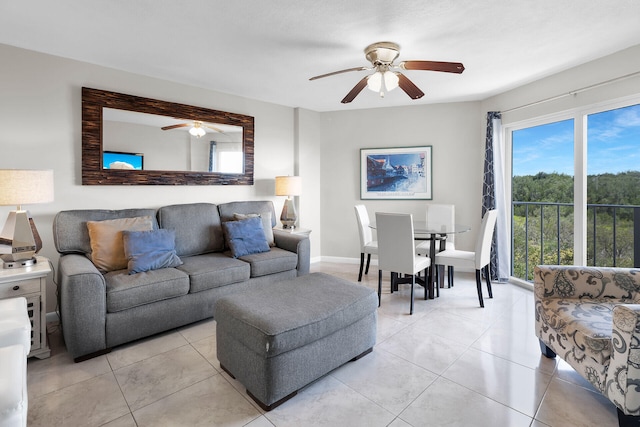 living room featuring light tile patterned flooring and ceiling fan