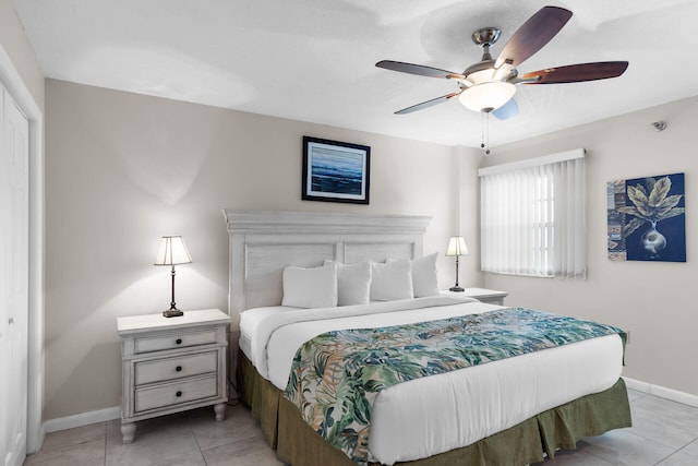 tiled bedroom with a closet and ceiling fan