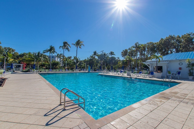 view of swimming pool with a patio area