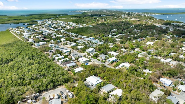 aerial view of property's location with a large body of water