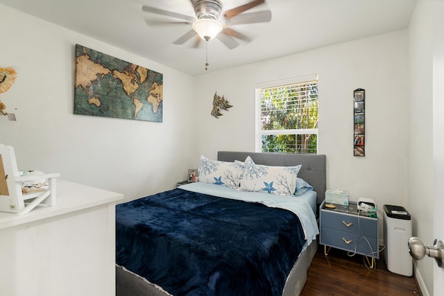 bedroom featuring wood finished floors and a ceiling fan